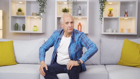Elderly-man-looking-at-camera-with-negative-expression.